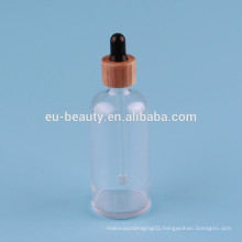 100 ml Clear Boston round bottle with woodiness dropper cap